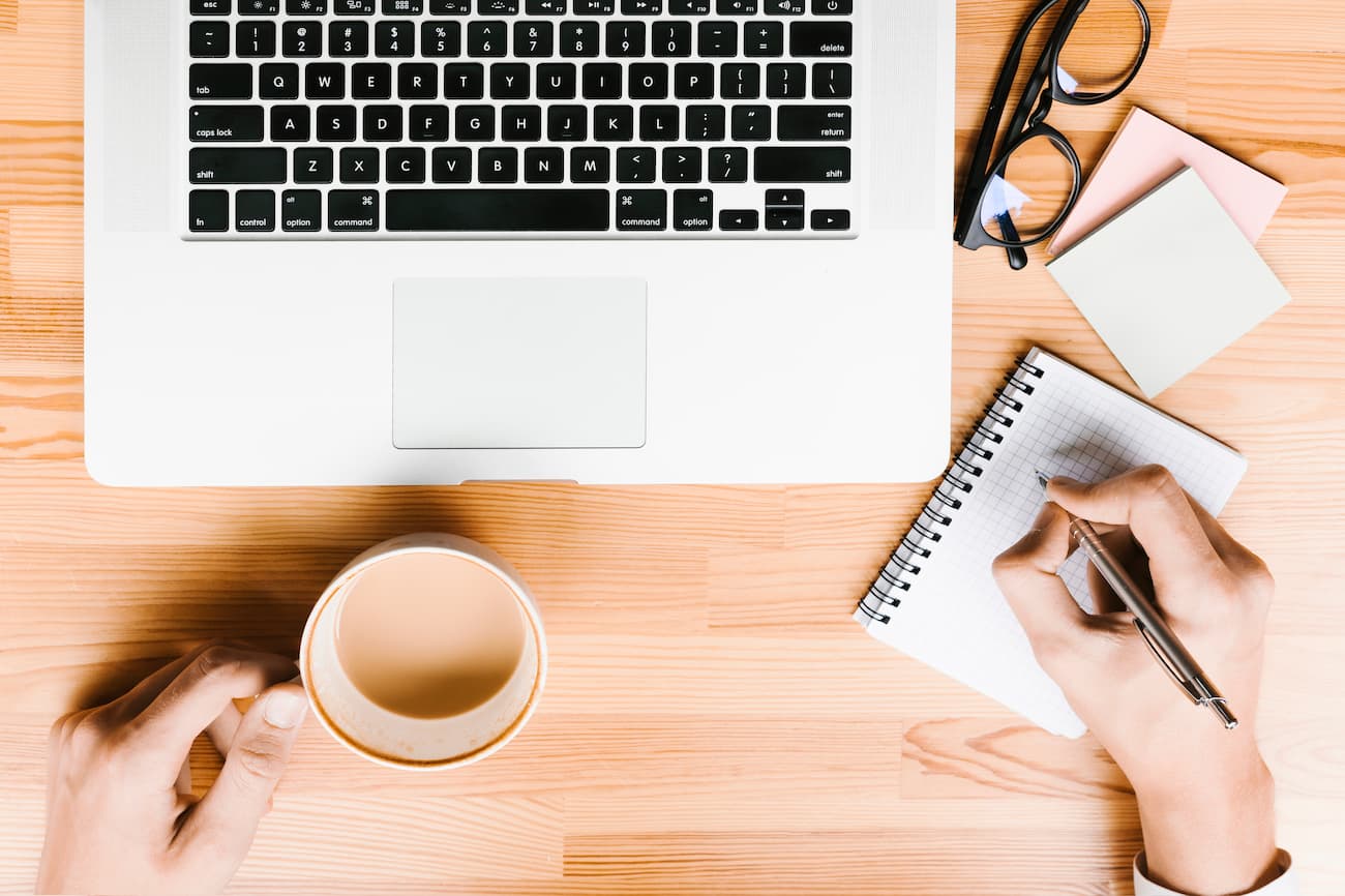 topview-workplace-with-laptop-coffee-wooden-background (1)